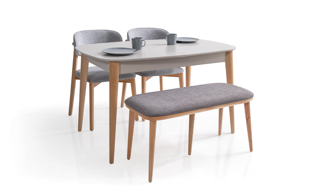 Capella modern mutfak masa takımı genel yerleşim; ahşap dokulu geniş masa, antrasit kumaşlı bench ve siyah metal ayaklı ergonomik sandalyeler.