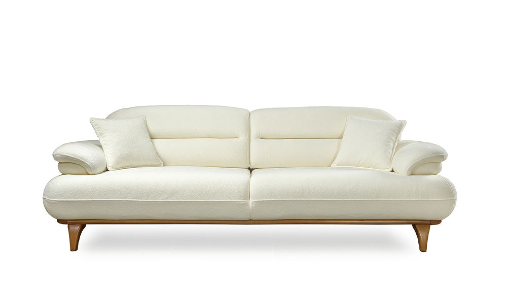 Lotus Modern üçlü koltuğun krem rengi coco kumaşlı, ahşap ve dolgun formlu önden görünümü.