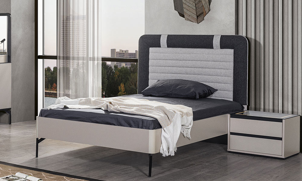 Olimpos Karyola'nın çift renkli gri kumaş başlığı, yatay dikiş detayları, metal yüksek ayakları ve modern antrasit yatak tasarımı.