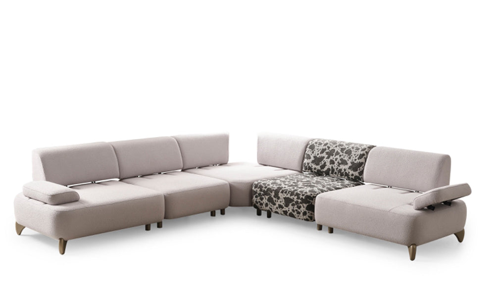 Yıldız Modern köşe koltuk modülünün kalın ve kavisli gövde yapısı ile sade bukle kumaş dokusunu gösteren yan profil görünümü.