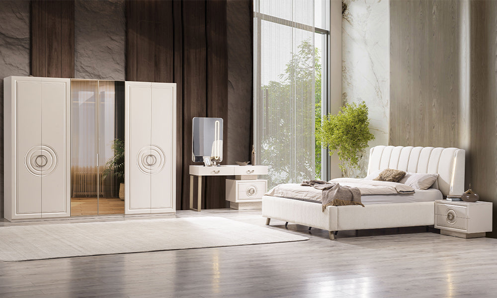 Alkan Modern Yatak Odası Takımı; ledli kumaş başlık, cam kapaklı gardırop, makyaj masası formunda şifonyer ve dairesel motifli komodinlerin lüks dekorasyonu.