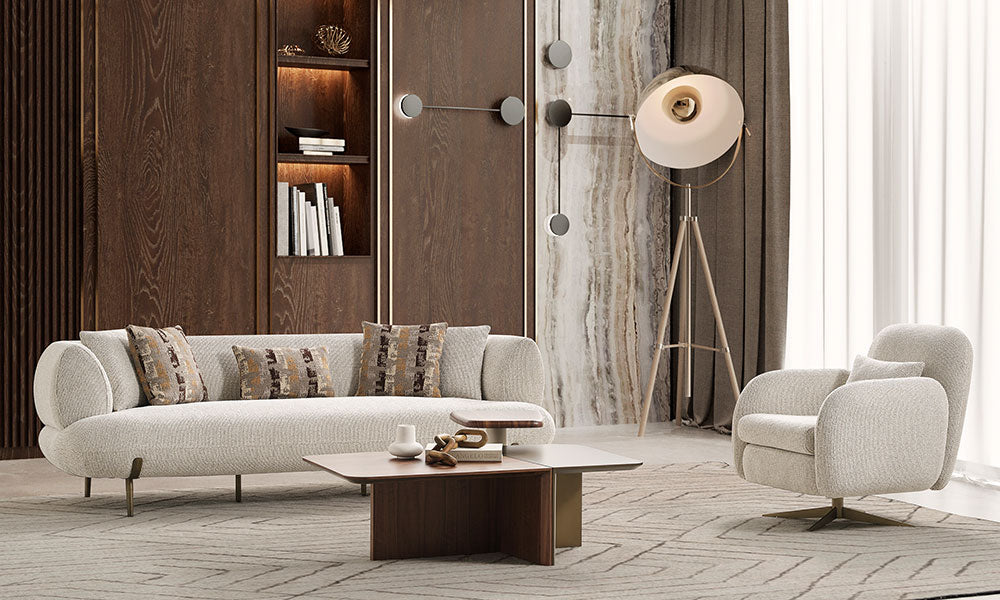 Modern ve lüks bir salonda, Candy koleksiyonuna ait gold ayaklı üçlü ve ikili koltuk ile döner berjerin şık duruşu.