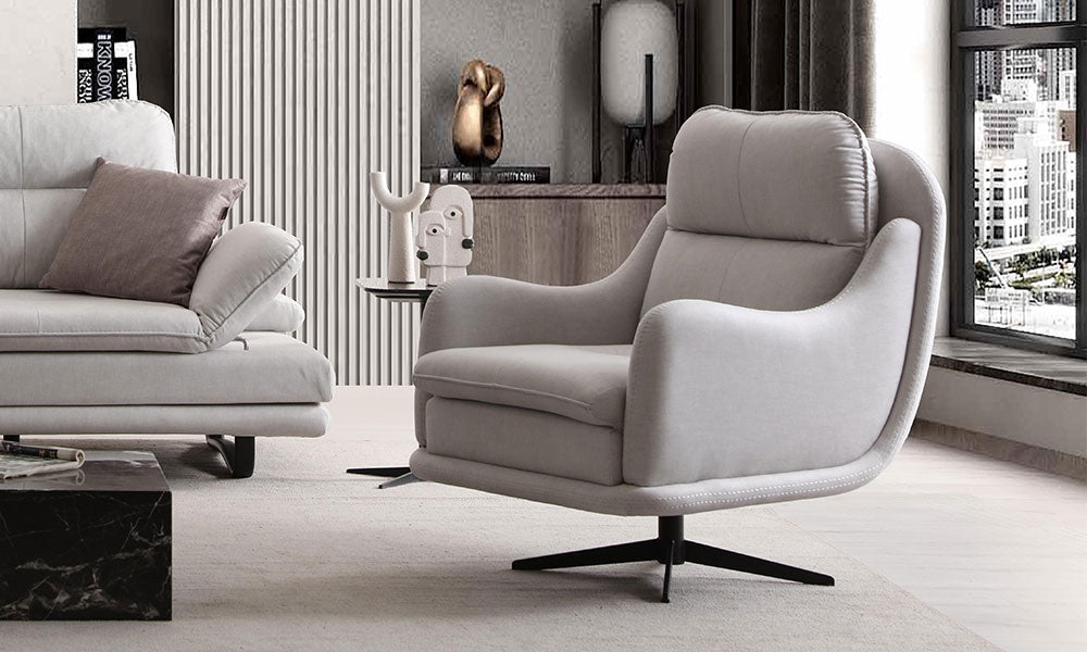 Fiesta Modern berjerin siyah metal yıldız ayaklı, ayarlanabilir başlıklı ve yüksek sırtlı konforlu tasarımının modern salondaki görünümü.