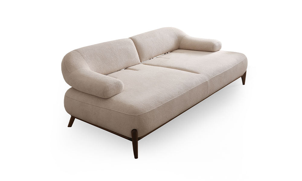 Fiore Modern krem koltuğun geniş oturumlu ve kavisli tasarımının üst açıdan görünümü.