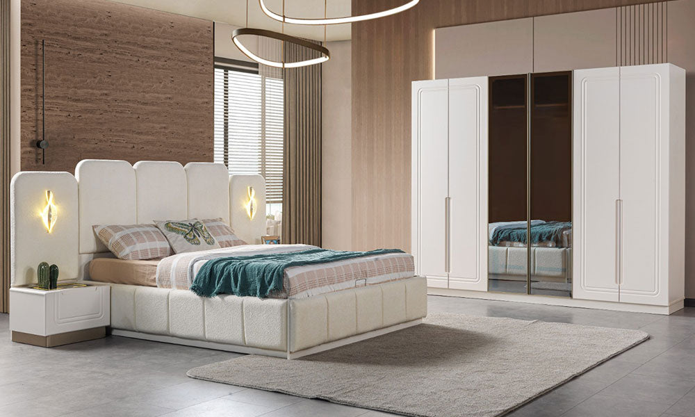 İklim Modern Yatak Odası Takımı'nın lüks bir salondaki tam takım duruşu; yüksek kumaş başlıklı bazalı karyola ve altı kapaklı gardırop.