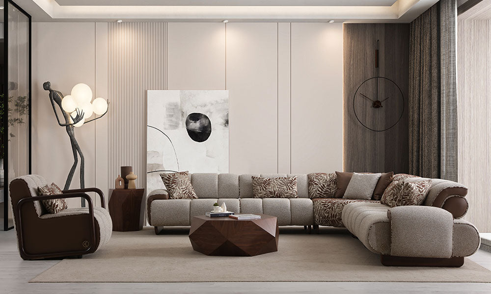 Modern bir salonda, Nois koleksiyonuna ait puf dikişli modüler köşe koltuk ve berjerin şık yerleşimi.