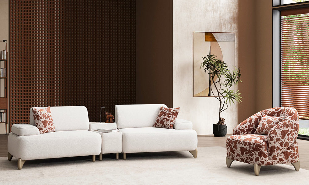 Yıldız Modern Koltuk Takımı'nın koyu fonlu bir salondaki tam takım uyumu; beyaz kanepe ve cow print berjer kontrastı.