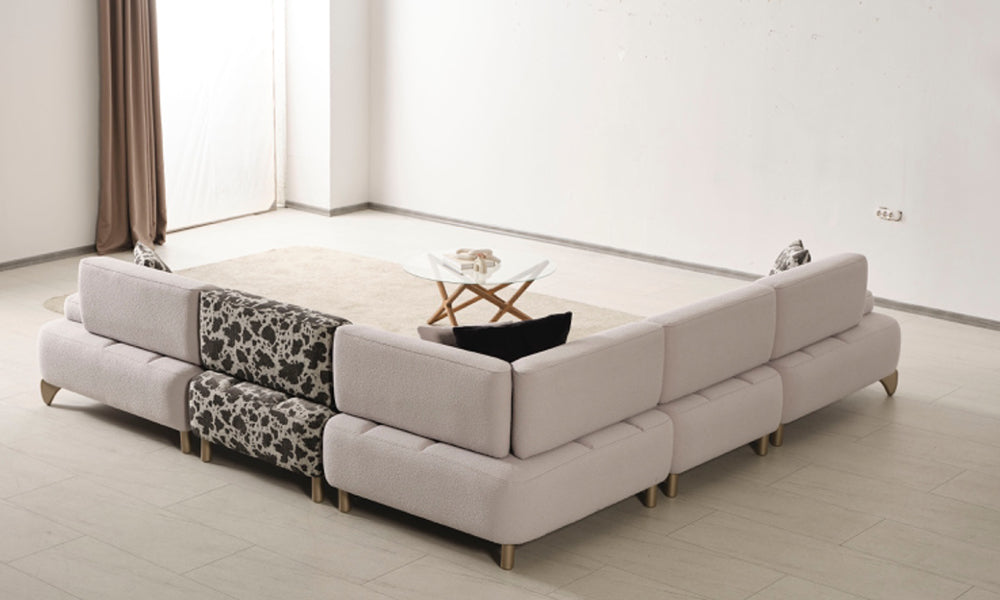 Yıldız Modern köşe koltuk takımının arkadan görünümü; modüler parçaların birleşimi ve metalik ayak detayları.